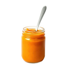 Pumpkin puree in glass jar with spoon isolated on transparent background