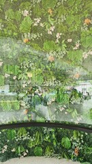 Intricate floral design on a curved glass surface.