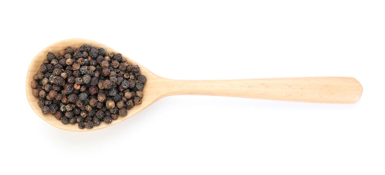 Aromatic peppercorns in wooden spoon isolated on white, top view