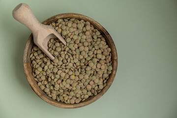 Green lentil copy space. Whole spelt grain species. High protein fiber-rich vegan plant based food ingredient. Gluten free superfood healthy nutritional dietary alternative food 