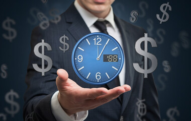 A businessman holding a clock in his hand with dollar signs floating in the background around him