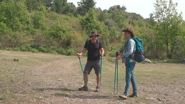 Two man frends Hikers are wildlife travelers on a nature trail