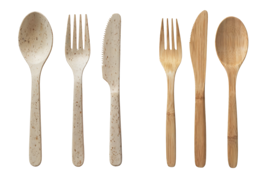 Top view of two eco-friendly disposable utensil sets, one made from wheat straw fiber and one from natural bamboo, includes spoon, fork, and knife, isolated on transparent background