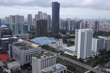 Obraz premium Aerial View Of Beautiful Skyline With Modern Skyscrapers With Cloudy Sky