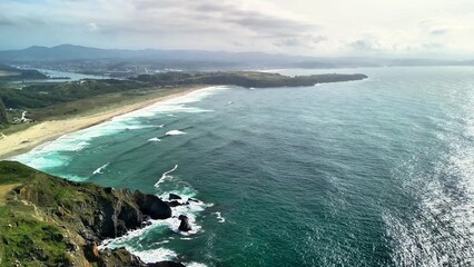 Enjoy the stunning coastal views of the serene ocean waves stretching to the horizon