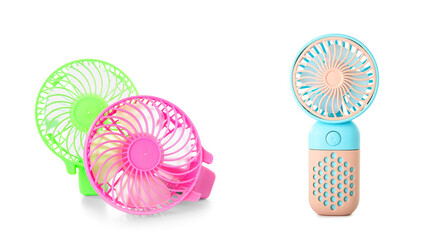 Set of small portable electric fans on white background