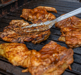 Grilling Marinated Chicken on Charcoal BBQ
