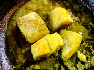cooking catfish soup in pan