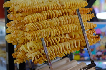 kentang ulir goreng. fried spiral potatoes at a food stall. fried potato