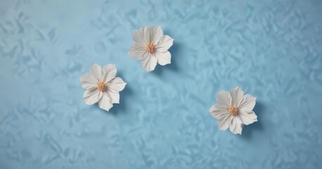 Colorful handmade paper blossoms, light blue, central empty area ,  background,  copy space
