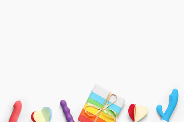 Rainbow LGBT gift box with paper heart and sex toys on white background. Valentine's day celebration