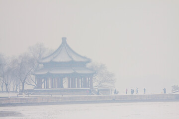 Snows in Beijing Summer Palace with historic buildings and traditional landscape