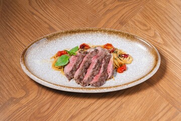 Grilled Beef Steak with Spaghetti Pasta on Rustic Plate