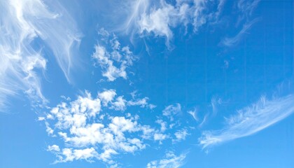 Blue sky with wispy and fluffy white clouds creating a dreamy and tranquil atmosphere. The light filters through the clouds forming an ethereal aesthetic.