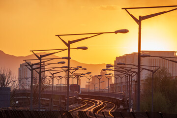 subway railway and electrical lamps facility at sunset