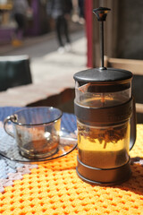 Brewing herbal tea in a cozy cafe setting
