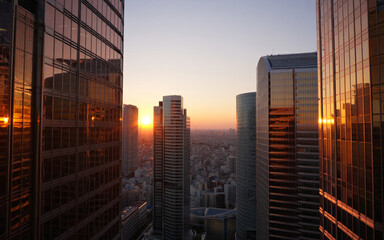 Modern skyscrapers reflecting sunset light in a vibrant city skyline
