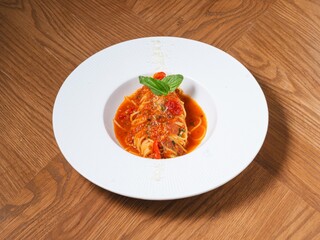 Spaghetti with Tomato Sauce and Basil on White Plate