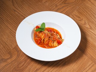 Spaghetti with Tomato Sauce and Basil on White Plate