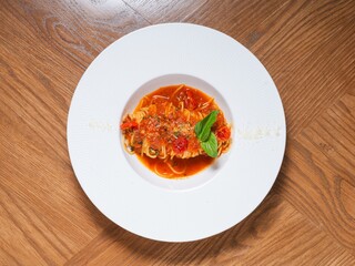 Spaghetti with Tomato Sauce and Basil on White Plate