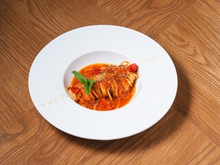 Spaghetti with Tomato Sauce and Basil on White Plate