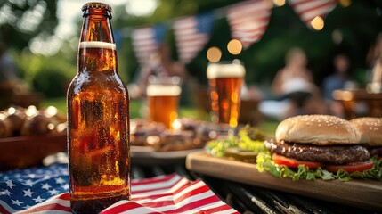 A beer bottle on a 4th of July BBQ table with flags and burgers