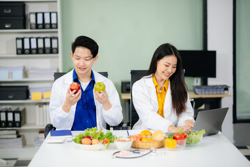 Doctors sharing fresh vegetables, promoting health and nutrition. Ideal for wellness, healthcare,...
