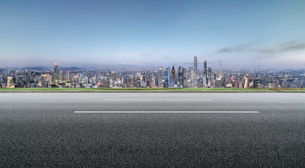 Fototapeta premium Cityscape Skyline with Empty Road