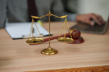 Male lawyer using phone, holding tablet, talking, giving legal advice, explaining to clients.
