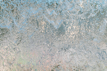 Aqua background. Product space next to clean water streams and water splashes and drops.