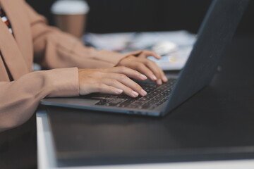 Business people team working at office with tablet and document, doing planning analyzing the financial report, business plan investment, finance analysis concept. Economic business discussions.