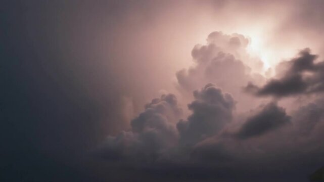 Dramatic Sky's Embrace: A captivating display of billowing, dark, and moody clouds painted across the vast canvas of the sky, as if foreshadowing an impending storm. 