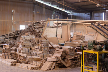 Teak wood log material ready to be processed into furniture in the factory