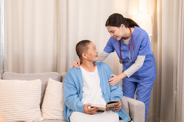 Nurse standing beside senior woman with book, both sharing a caring moment and discussing treatment at home, showing professional and emotional care, healthcare, caregiver, hospitality.