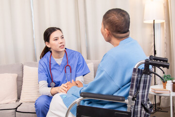 Obraz premium Senior woman in wheelchair discussing health with nurse on sofa, both smiling and sharing emotional connection, illustrating trust and support in home care setting, healthcare, illness, patient.