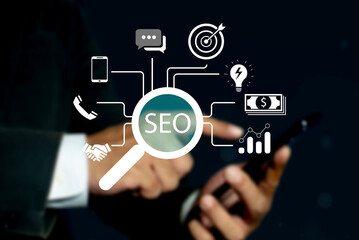 Businessman using a computer with SEO Search Engine optimization on virtual screen. Search engine...
