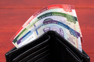 Liberian Dollar in the black wallet