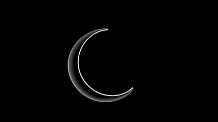 Obraz premium Crescent moon shining brightly against a dark night sky during a clear evening