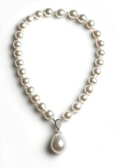 A classic pearl necklace with a teardrop pendant, displayed gracefully against a white background. Stock