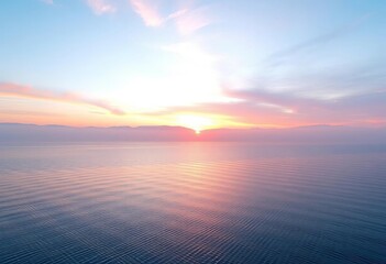 Obraz premium Dreamy sunrise over tranquil lake, pastel pink and blue hues, misty mountains, soft, gentle