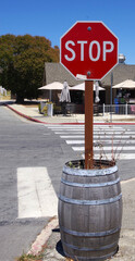 Small-town STOP sign in a barrel