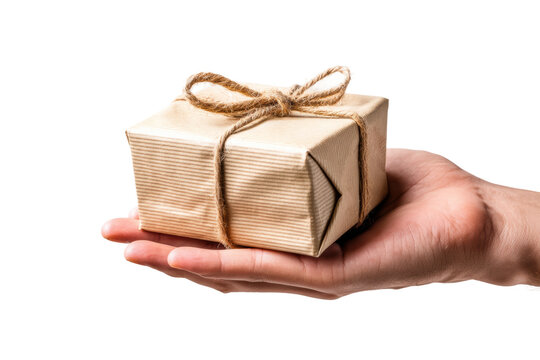 Gift wrapped box in hand with brown string on white background, cut out
