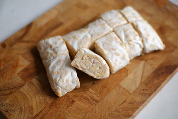 Tempeh on wooden board 