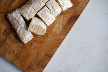 Tempeh on wooden board 