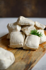 White tofu on wooden board 