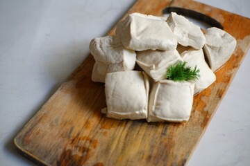 White tofu on wooden board 