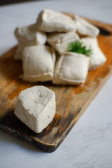 White tofu on wooden board 