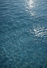 Serene blue water, gentle ripple, sunlit surface, daytime, nature