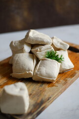 White tofu on wooden board