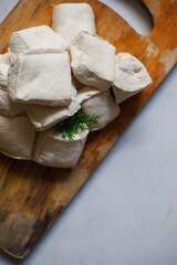 White tofu on a wooden board 